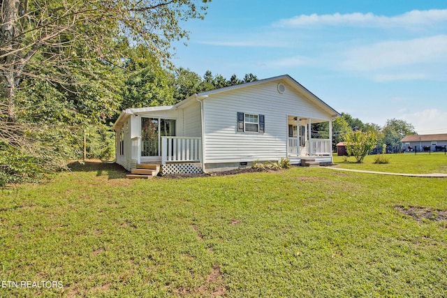 view of front of house featuring a front yard and a porch