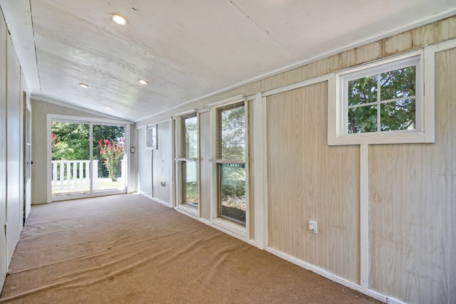 unfurnished sunroom with lofted ceiling and a wealth of natural light