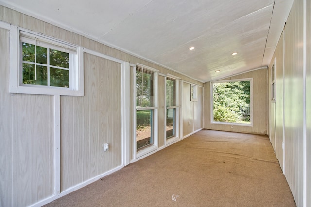 unfurnished sunroom featuring lofted ceiling