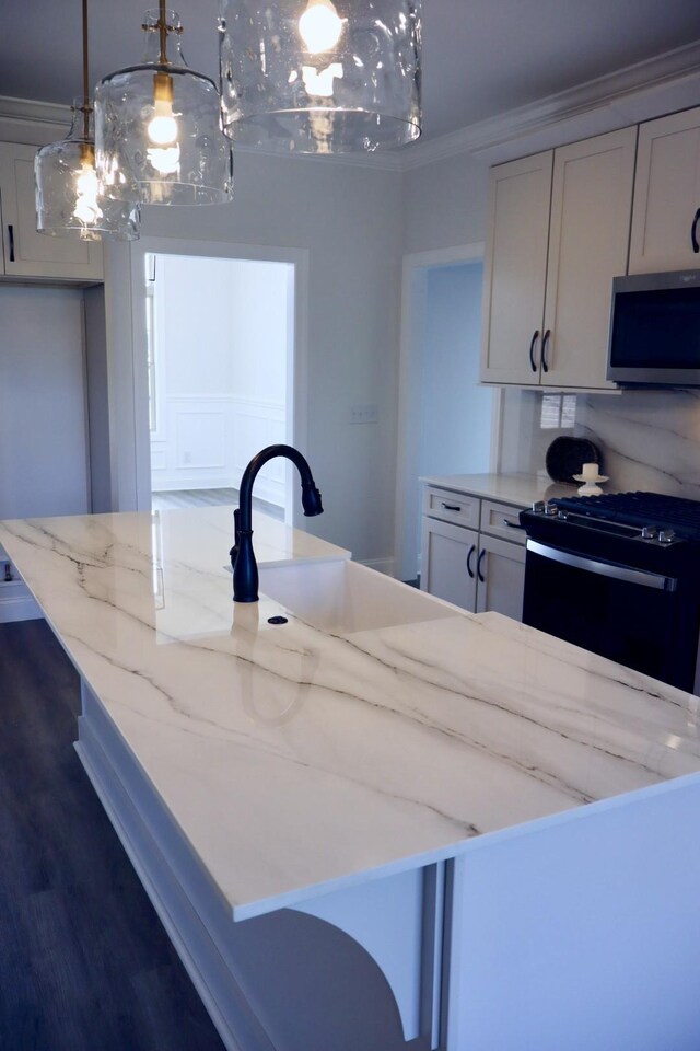 kitchen featuring light stone counters, white cabinets, hanging light fixtures, black / electric stove, and dark hardwood / wood-style floors