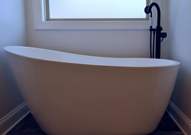 bathroom featuring a bathing tub and sink