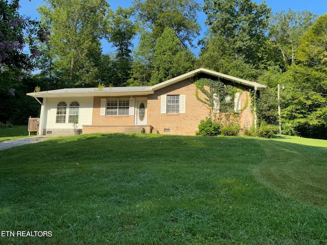 ranch-style home featuring a front yard, brick siding, and crawl space