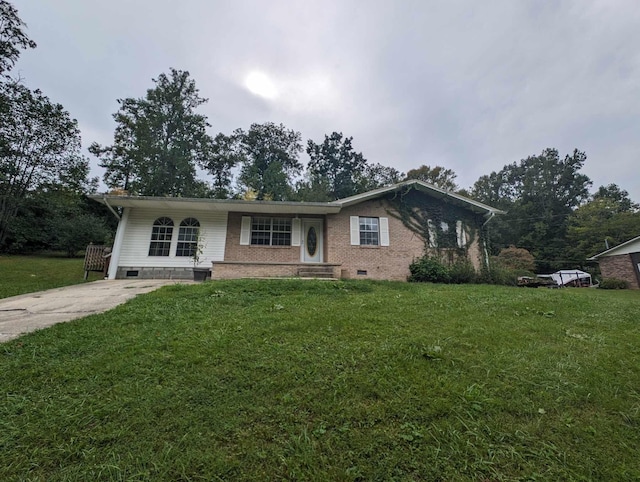 ranch-style house featuring a front yard, brick siding, driveway, and crawl space