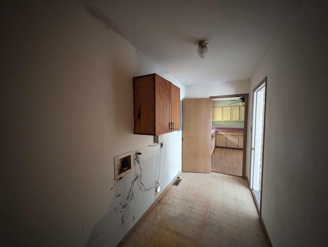 laundry room with visible vents, cabinet space, hookup for a washing machine, and light floors