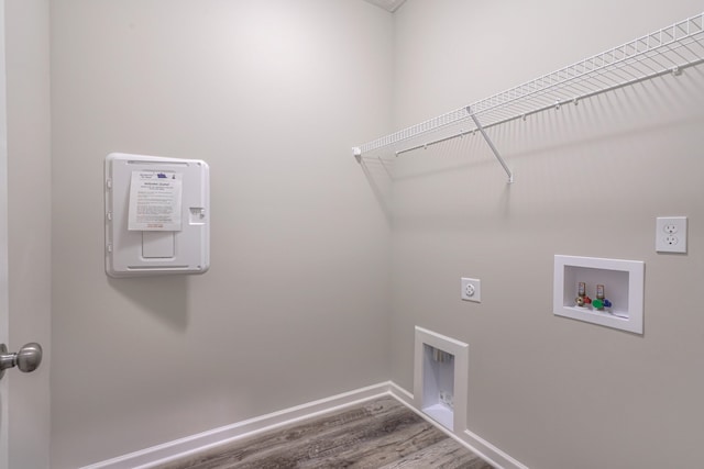 washroom with washer hookup, hardwood / wood-style flooring, and hookup for an electric dryer