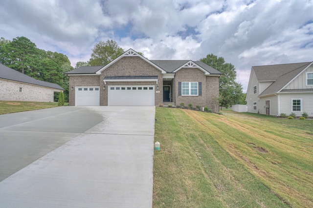 view of front of house with a garage and a front lawn