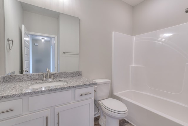 full bathroom featuring vanity, toilet, and shower / washtub combination