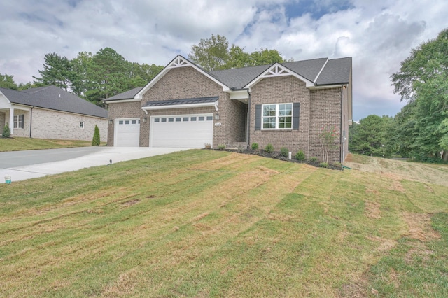 view of front of house featuring a garage and a front yard