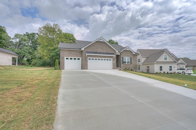 craftsman house with a front lawn and a garage