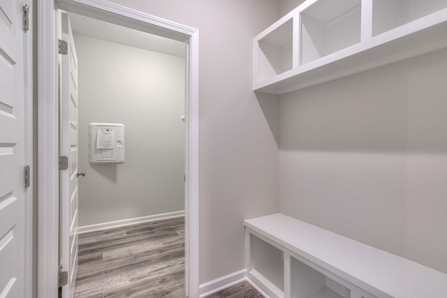 mudroom featuring wood-type flooring and a textured ceiling