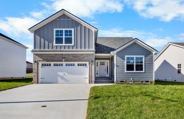 view of front of property featuring a garage and a front yard