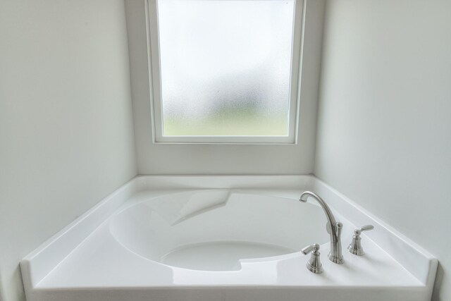 bathroom with a tub