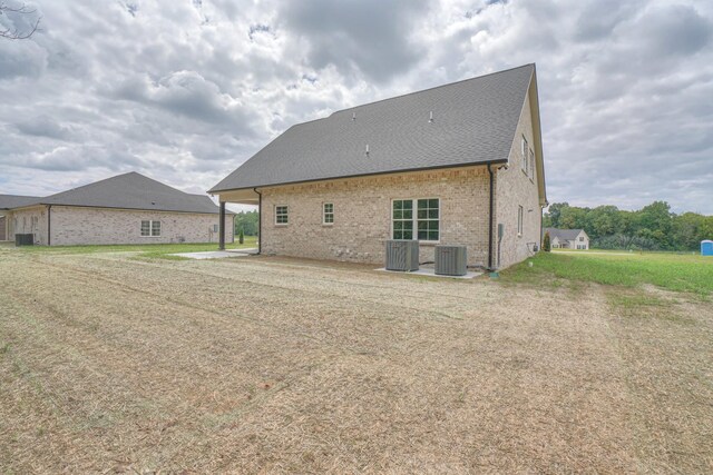 back of house featuring central AC and a patio