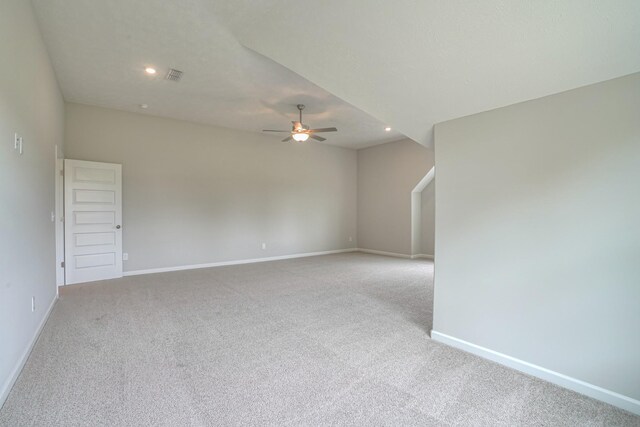 carpeted empty room featuring ceiling fan