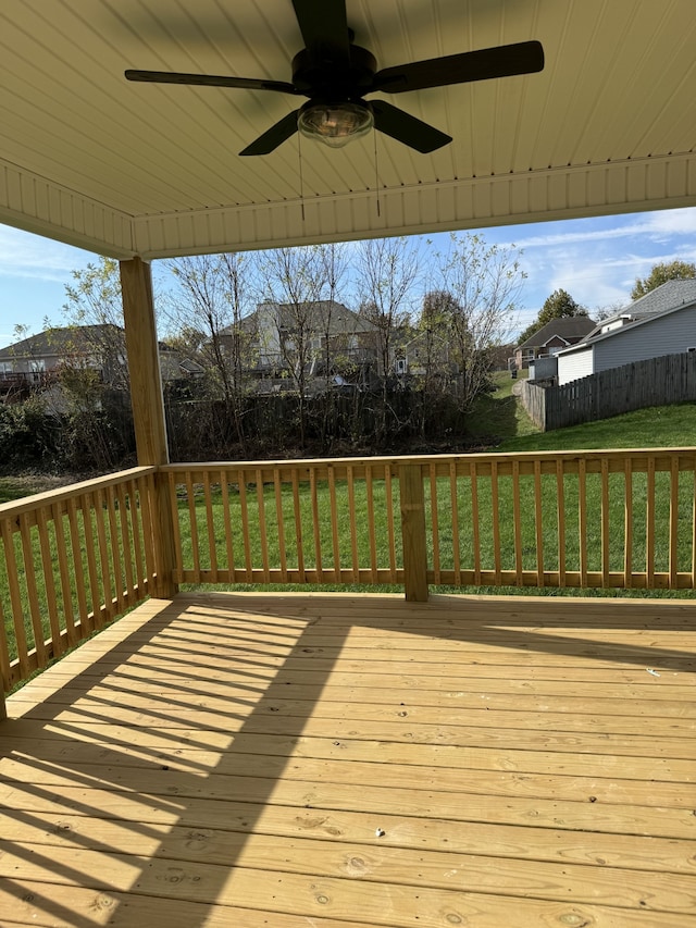 wooden terrace with a yard and ceiling fan