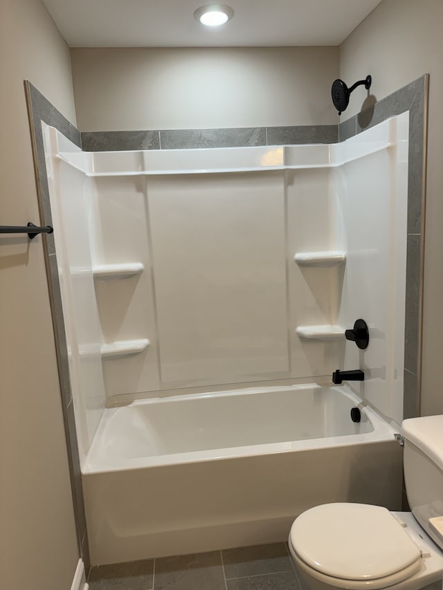 bathroom with tile patterned floors, toilet, and shower / bath combination