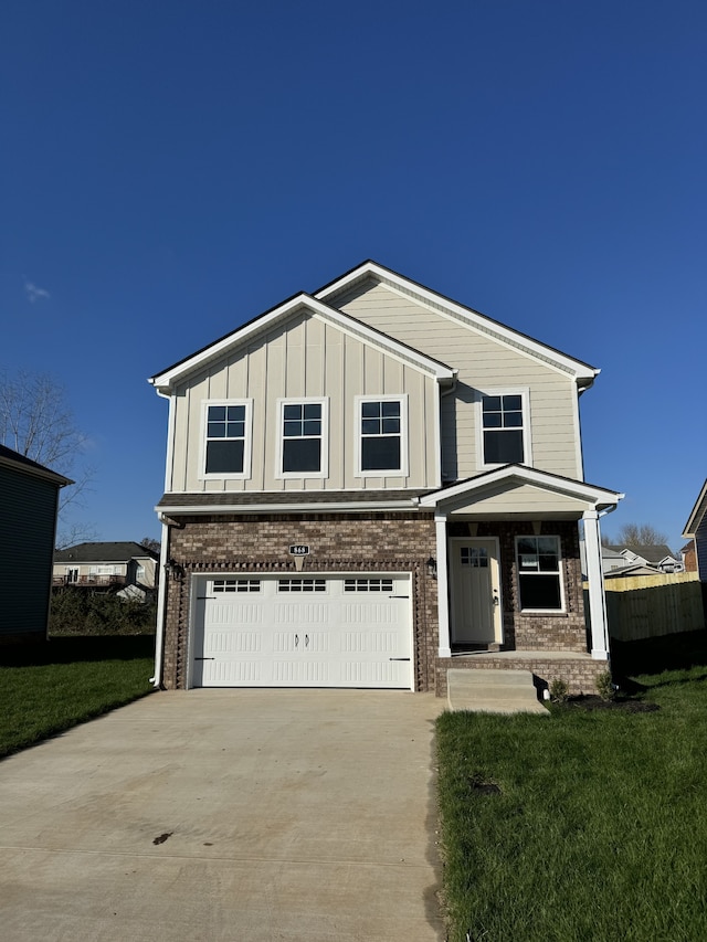 view of front facade featuring a porch, a garage, and a front lawn