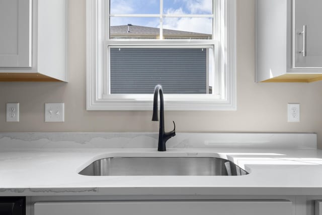 138 Anderson Pl, Clarksville, TN 37042 - room details with white cabinets and a sink