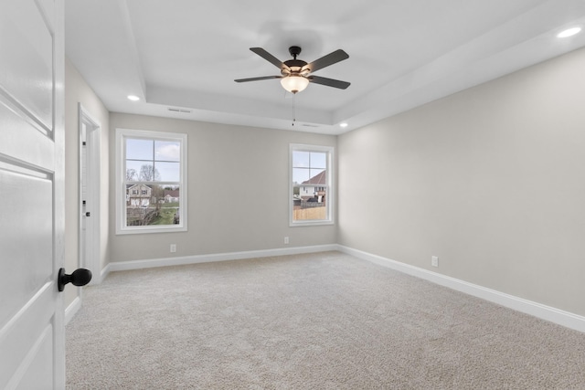 138 Anderson Pl, Clarksville, TN 37042 - carpeted empty room featuring visible vents, baseboards, ceiling fan, recessed lighting, and a tray ceiling