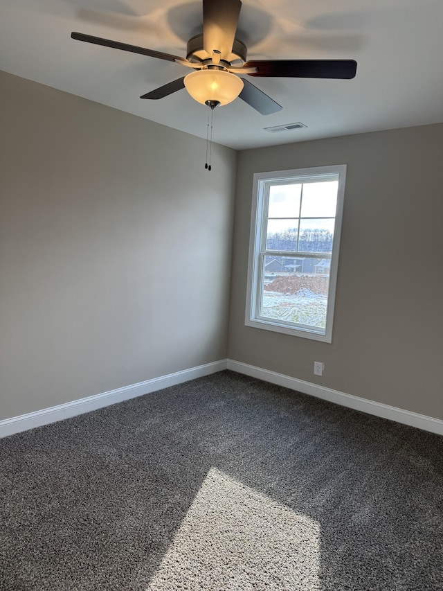 empty room featuring carpet floors and ceiling fan