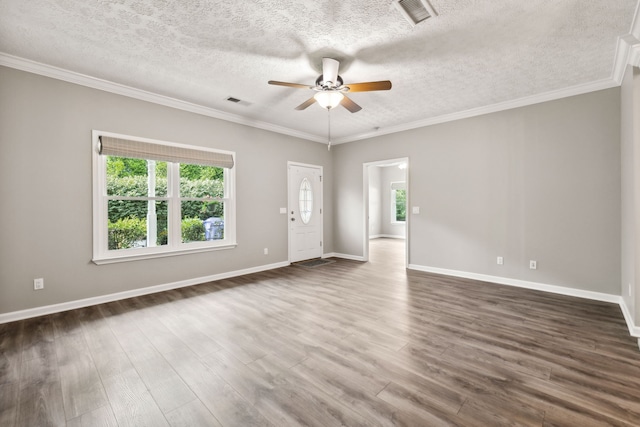 spare room featuring ceiling fan, wood-type flooring, a textured ceiling, and plenty of natural light