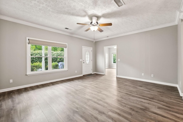 unfurnished room with crown molding, ceiling fan, dark hardwood / wood-style floors, and a wealth of natural light