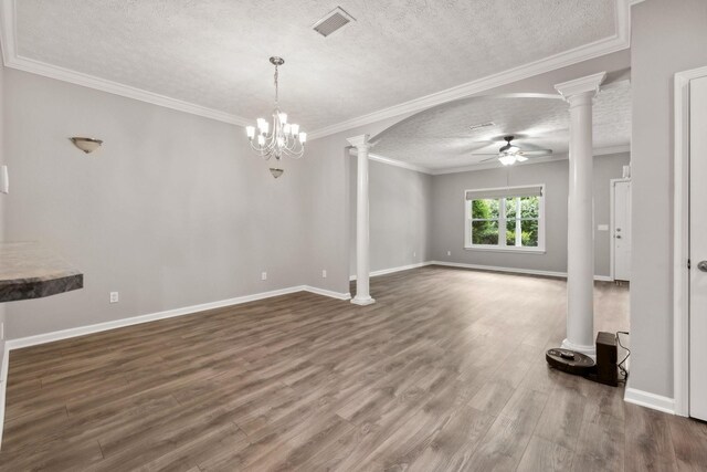 empty room featuring a textured ceiling, ceiling fan with notable chandelier, hardwood / wood-style flooring, and ornamental molding