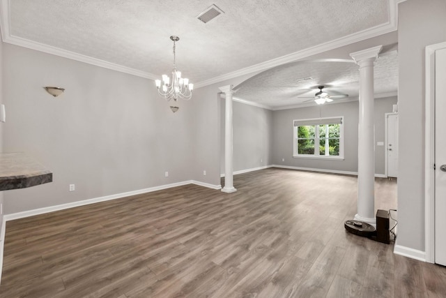 unfurnished living room featuring hardwood / wood-style flooring, ornamental molding, a textured ceiling, ceiling fan with notable chandelier, and ornate columns