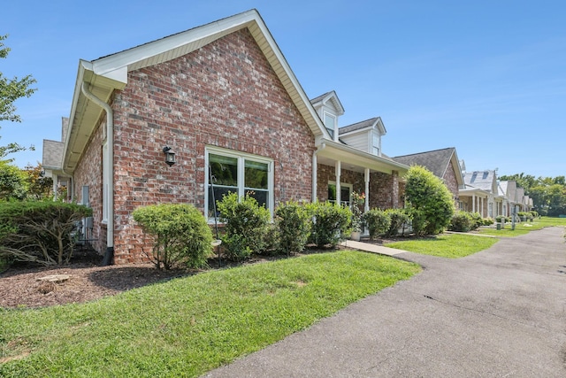 view of home's exterior featuring a lawn