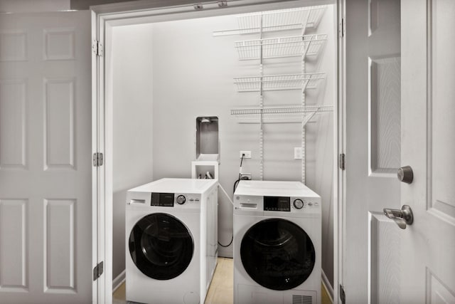 laundry room with independent washer and dryer