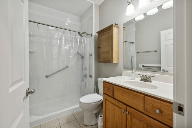 bathroom with curtained shower, vanity, tile patterned flooring, and toilet