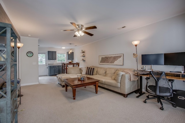 living room featuring light colored carpet and ceiling fan