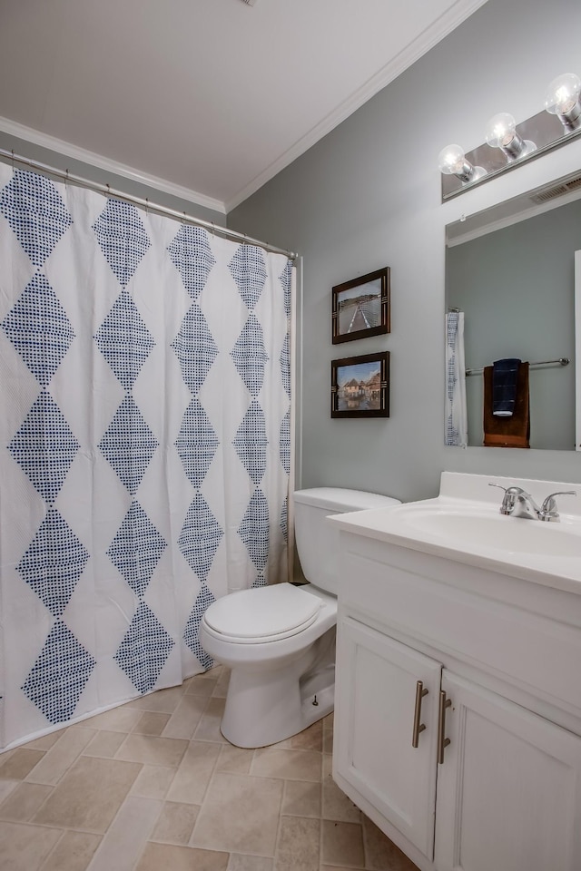 bathroom with vanity, ornamental molding, toilet, and walk in shower