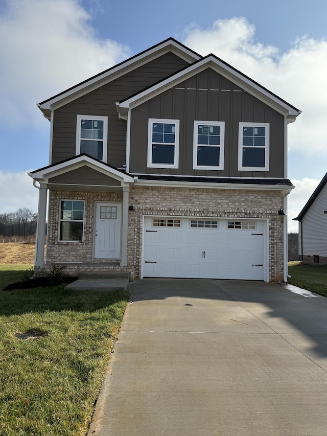 view of front of property with a front yard and a garage