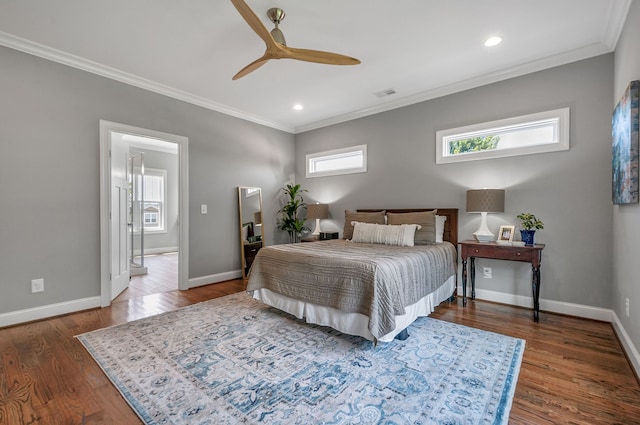 bedroom featuring ceiling fan, ornamental molding, and wood-type flooring