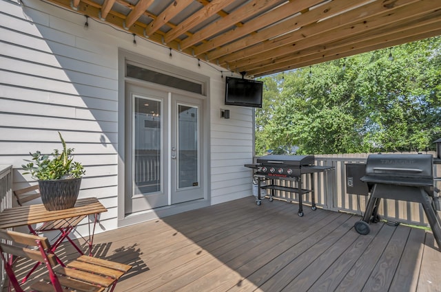 wooden deck featuring grilling area