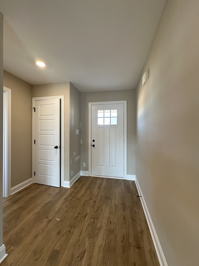 doorway featuring dark wood-type flooring