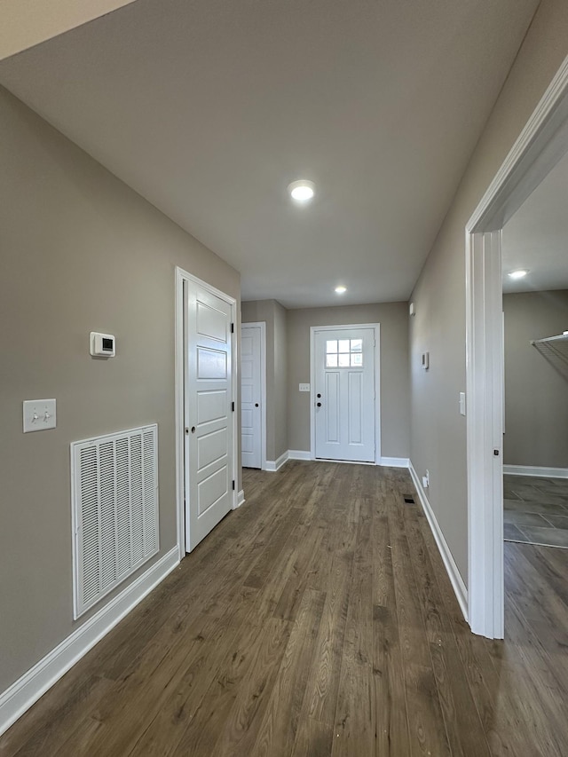 doorway to outside with dark hardwood / wood-style flooring