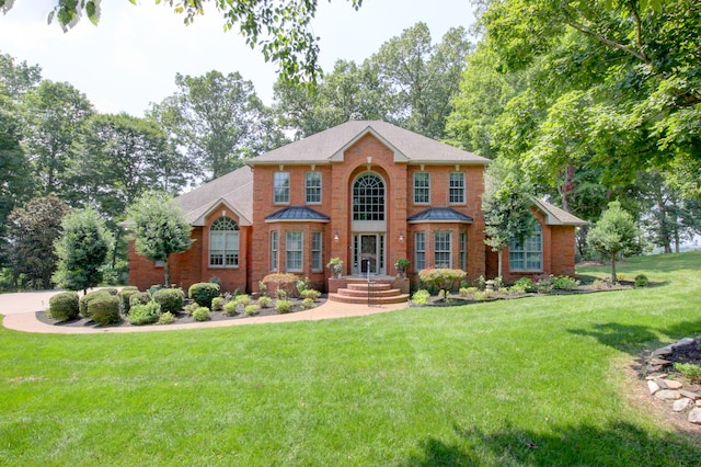 colonial home with a front lawn