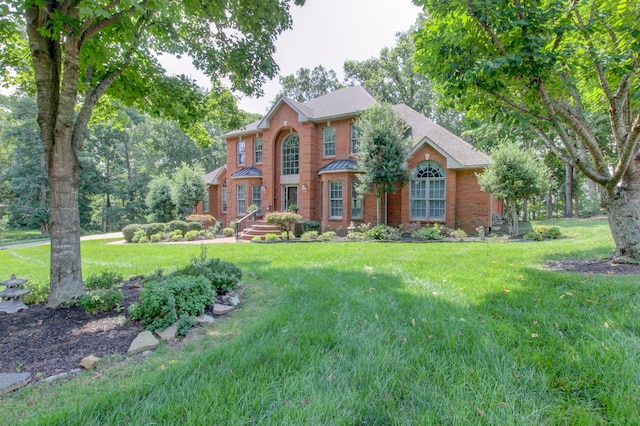 colonial-style house with a front lawn