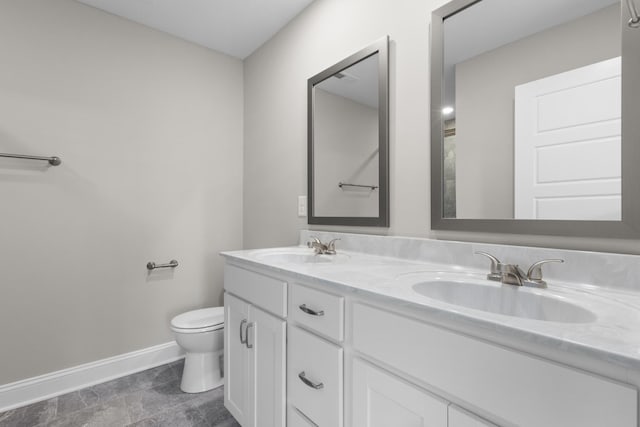 bathroom with toilet and vanity