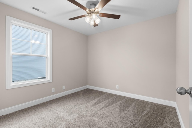 carpeted empty room with ceiling fan