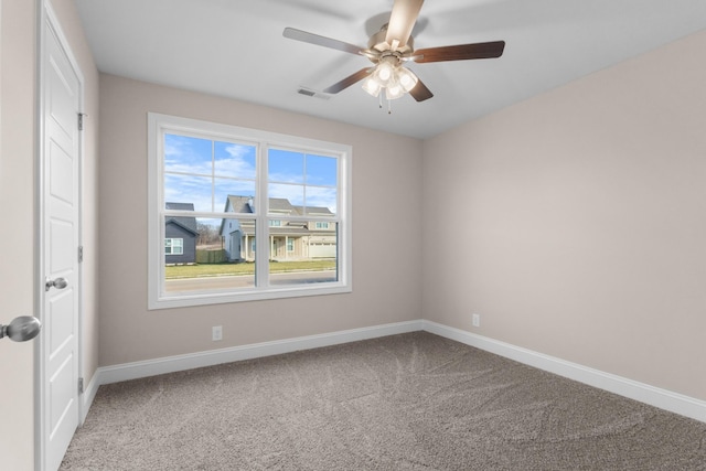 carpeted empty room with ceiling fan