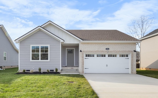 view of front of home with a front yard and a garage