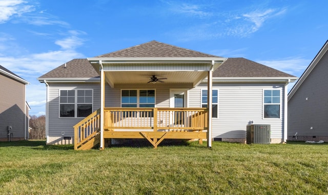 rear view of house with cooling unit, a yard, a deck, and ceiling fan