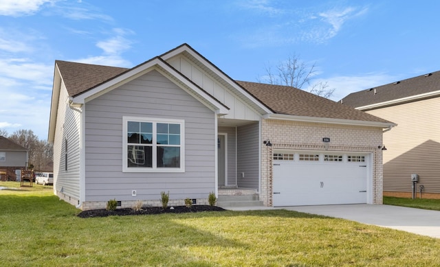 view of front of home featuring a front yard and a garage