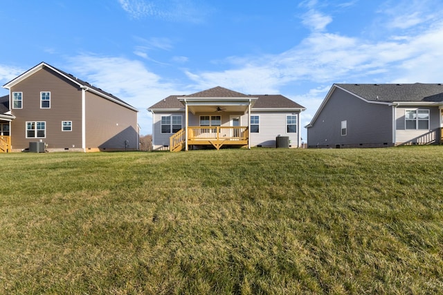 rear view of property featuring a lawn, central AC, a deck, and ceiling fan