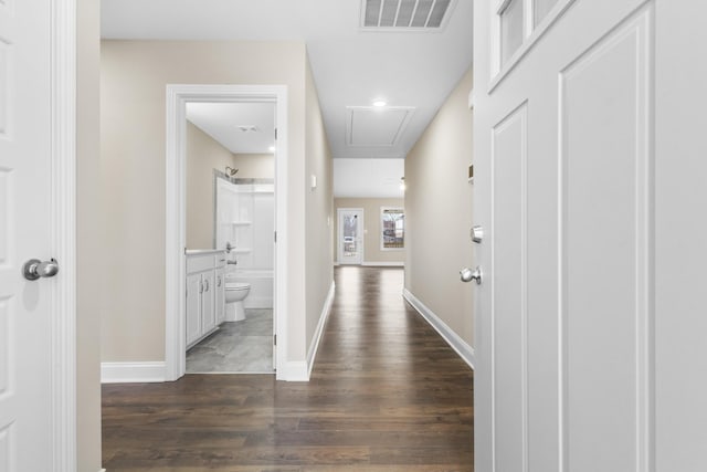 corridor featuring dark hardwood / wood-style flooring