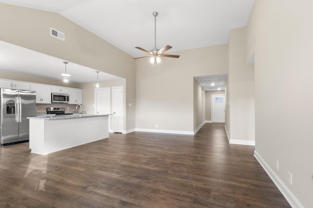 kitchen with a center island with sink, appliances with stainless steel finishes, ceiling fan, pendant lighting, and white cabinetry