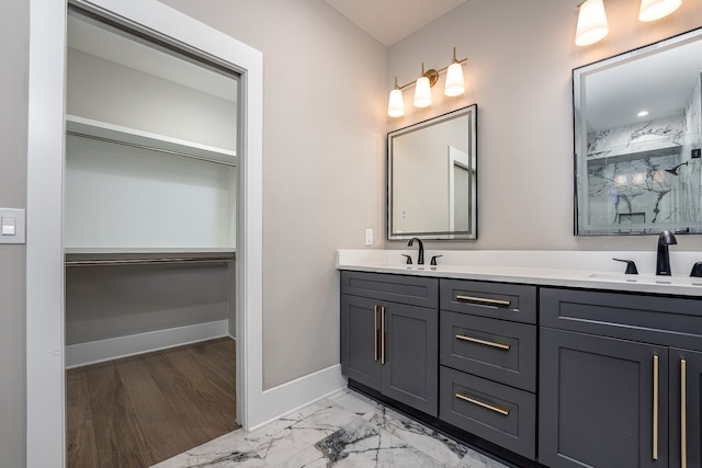 bathroom featuring dual vanity and wood-type flooring